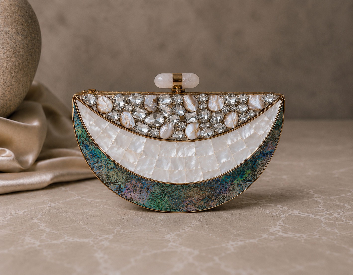 Half-moon clutch with crystal and baroque pearl upper band, mother-of-pearl tiles and abalone edge