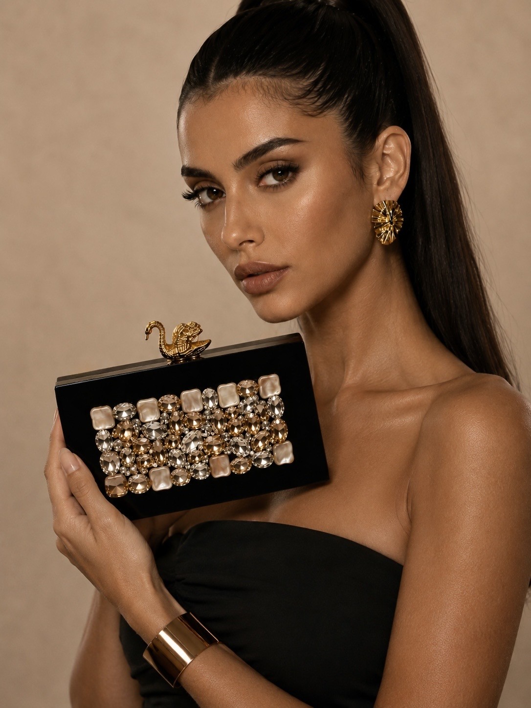 Model carrying The Golden Swan Clutch