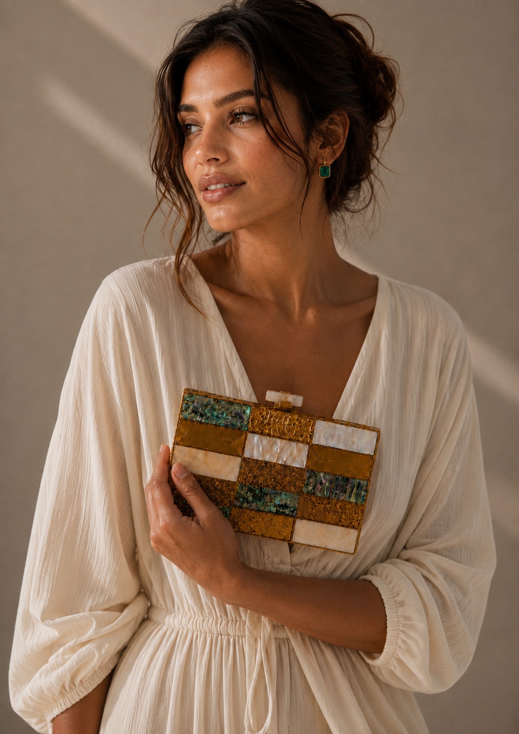 Model holding The Golconda Checkerboard Clutch checkerboard clutch