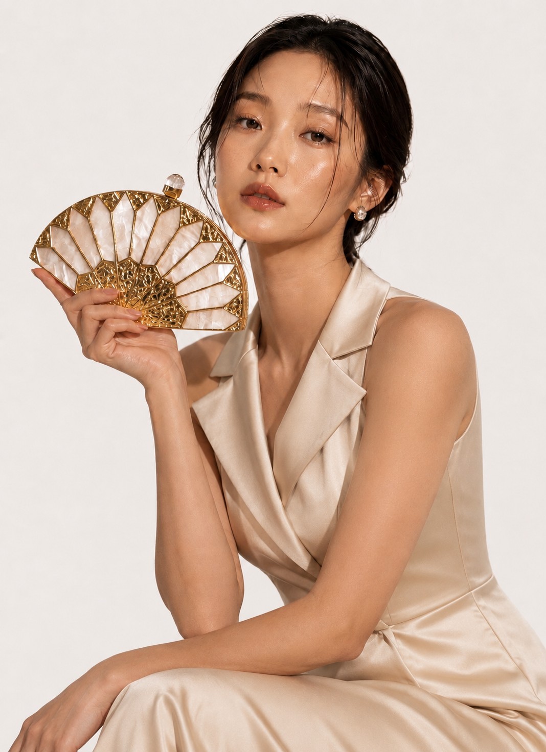 Model holding The Imperial Fan Minaudière fan clutch